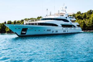 Luxury mega yacht moored ashore in a tropical setting